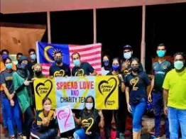 Volunteers with Malaysian flag