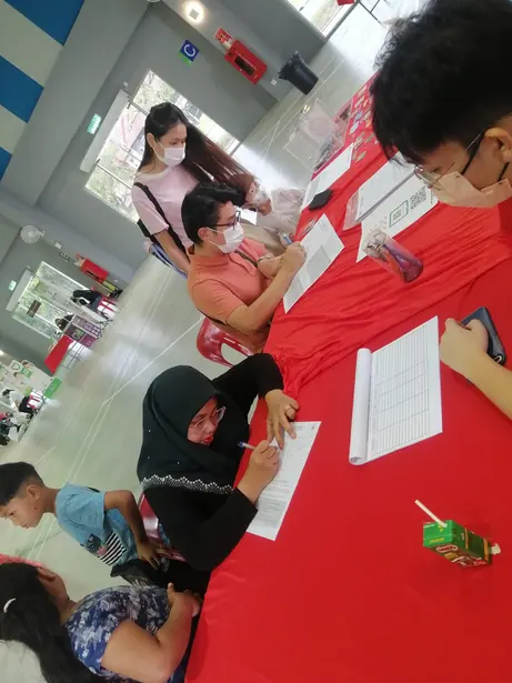 Blood donation drive volunteers and donors